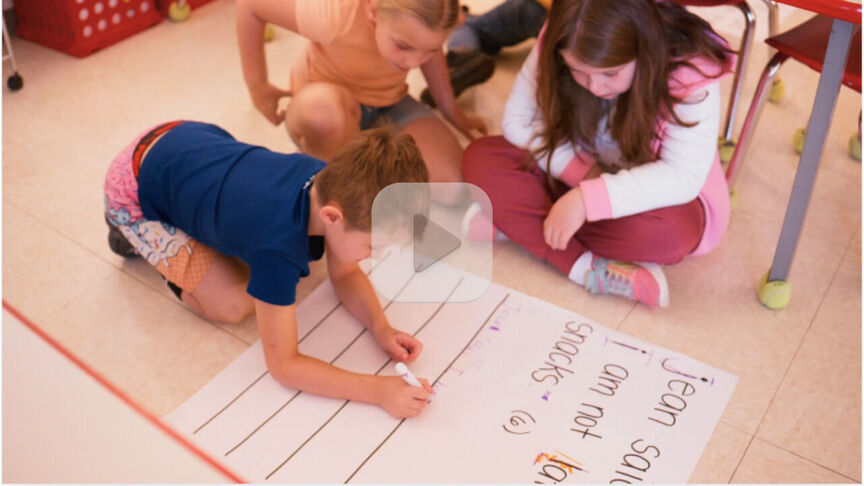 Students working on the floor